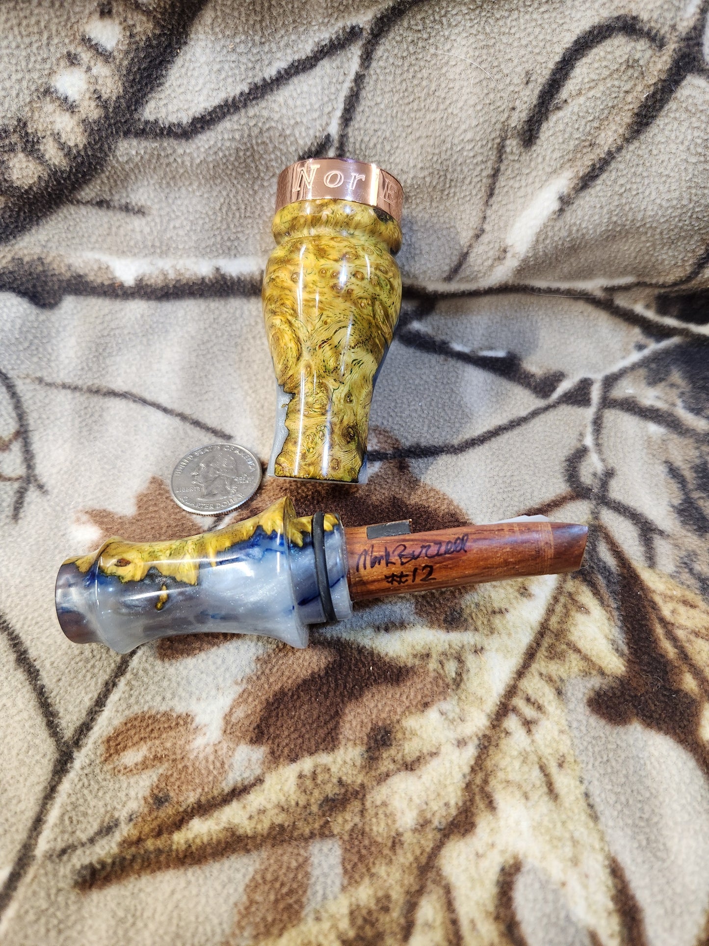 Double reed duck call made from stabilized and dyed amboyna burl wood with cocobolo wood tone board