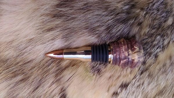 50cal BMG wine bottle stopper with double dyed boxelder burl wood