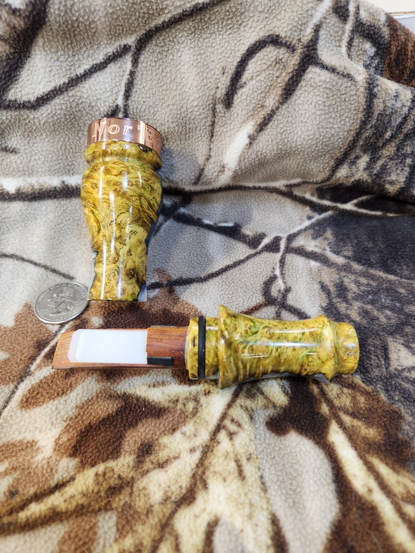 Double reed duck call made from stabilized and dyed amboyna burl wood with cocobolo wood tone board