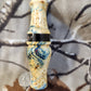 Double reed duck call made from stabilized and dyed yellow cedar burl wood and cocobolo tone board