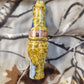 Double reed duck call made from stabilized and dyed amboyna burl wood with cocobolo wood tone board