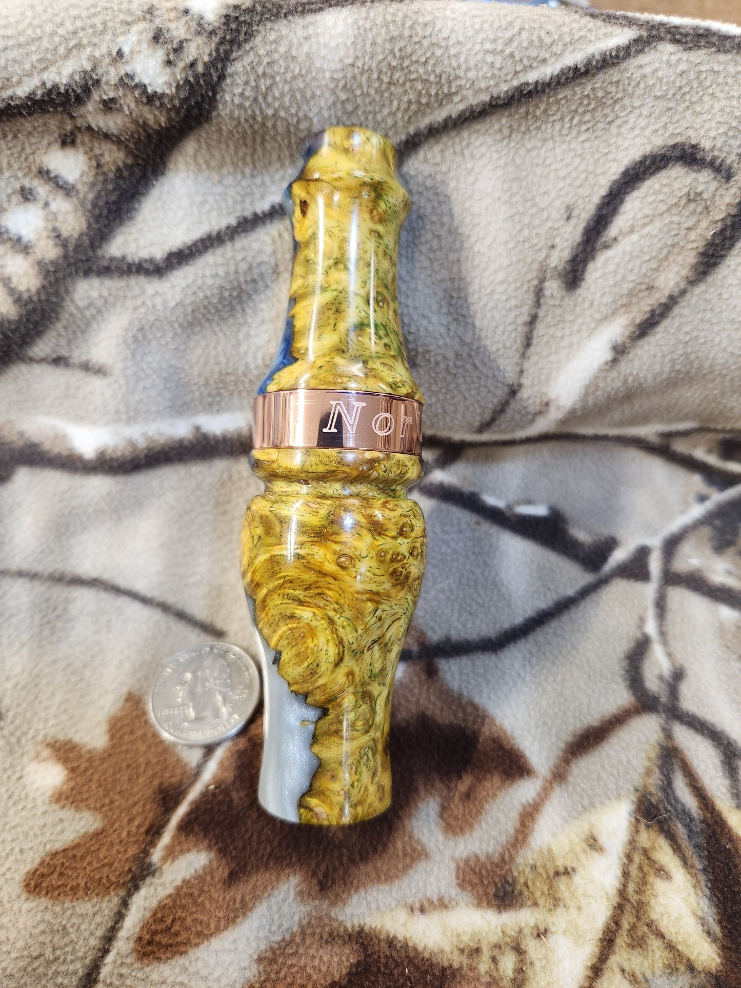 Double reed duck call made from stabilized and dyed amboyna burl wood with cocobolo wood tone board