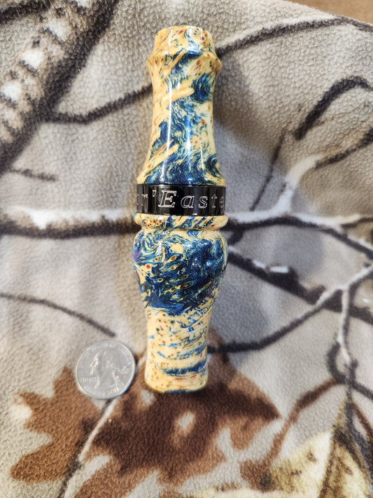 Double reed duck call made from stabilized and dyed yellow cedar burl wood and cocobolo tone board
