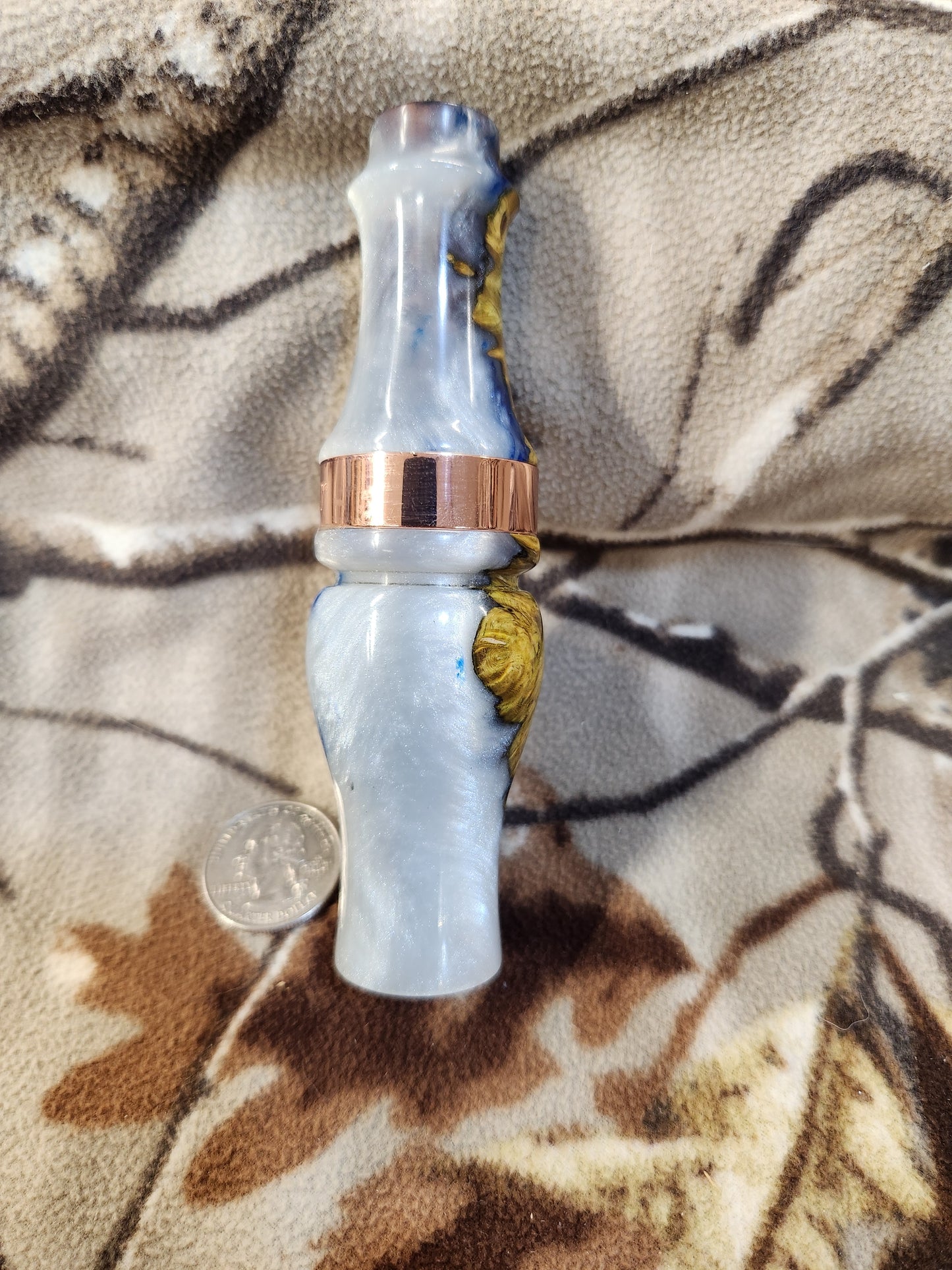 Double reed duck call made from stabilized and dyed amboyna burl wood with cocobolo wood tone board
