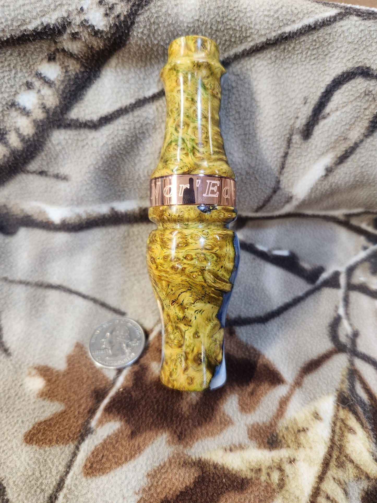 Double reed duck call made from stabilized and dyed amboyna burl wood with cocobolo wood tone board