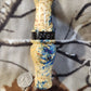 Double reed duck call made from stabilized and dyed yellow cedar burl wood and cocobolo tone board