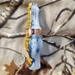 Double reed duck call made from stabilized and dyed amboyna burl wood with cocobolo wood tone board