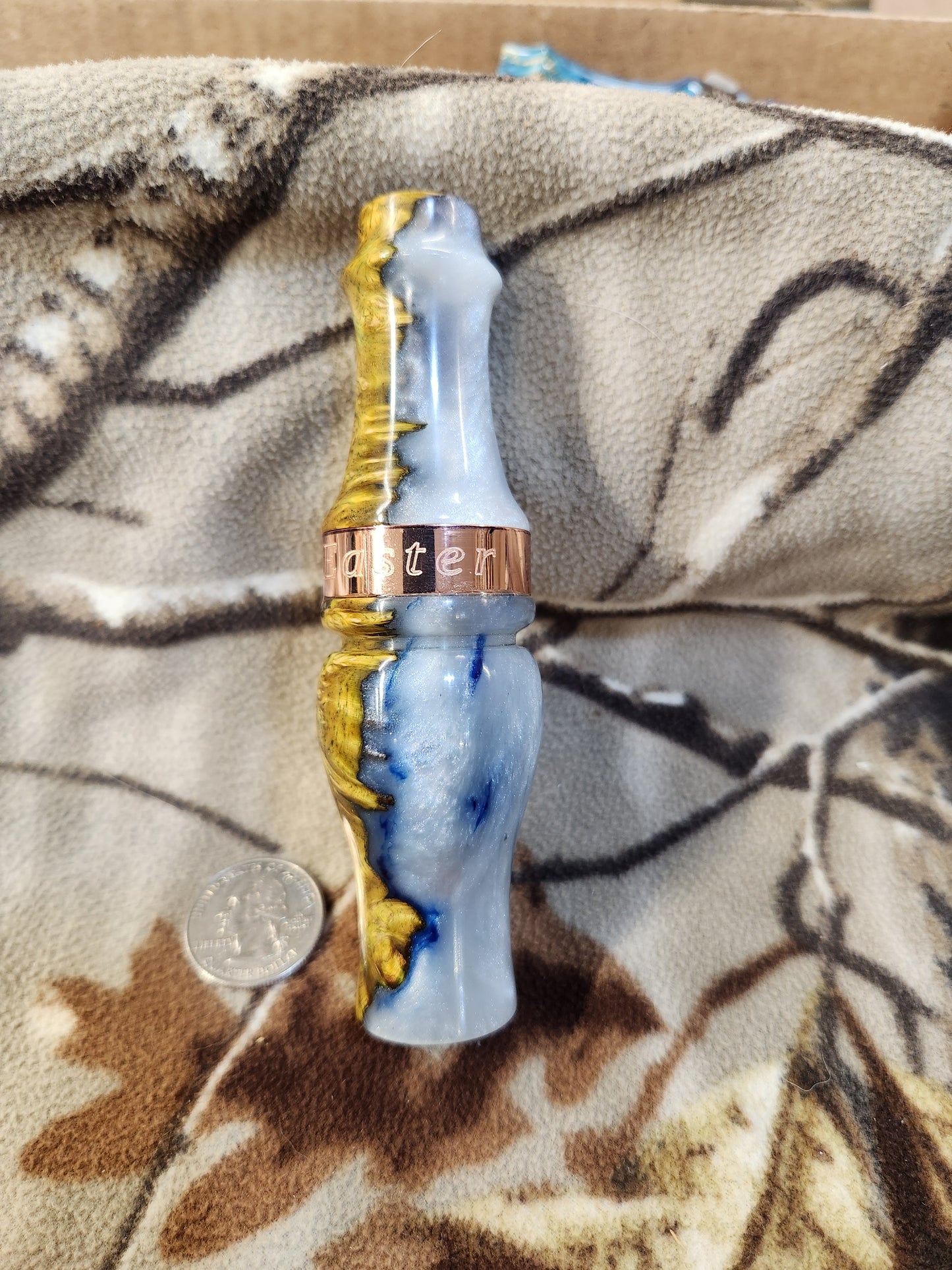 Double reed duck call made from stabilized and dyed amboyna burl wood with cocobolo wood tone board