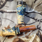 Double reed duck call made from stabilized and dyed yellow cedar burl wood and cocobolo tone board