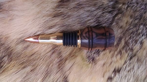 50cal BMG wine bottle stopper with stripped ebony
